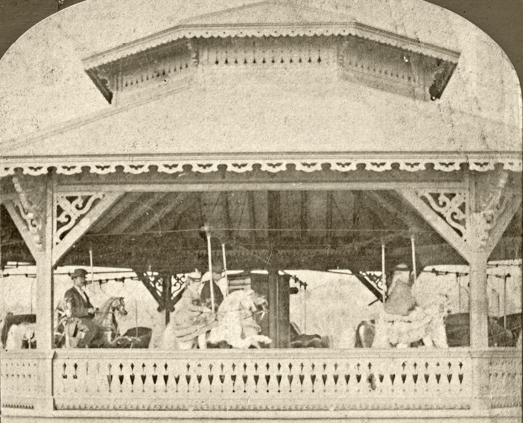 Undated stereoview of the Prospect Park carousel showing Christian-style raised front legs on the horses, center and left. The horse on the right does not have elevated front legs. This carousel, as well as Central Park’s, may also have become a hybrid by the date of these photographs, with two styles of horses showing. Barbara Williams collection