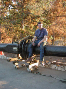 Dan sits on an early 1900s carousel center pole recently unloaded off a truck.