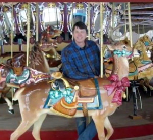 Dan with a Muller deer aboard the restored Astroworld carousel.