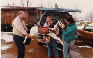 Jerry Ottoway (center), Thane Snider (right) and a friend unload one of the needy horses.
