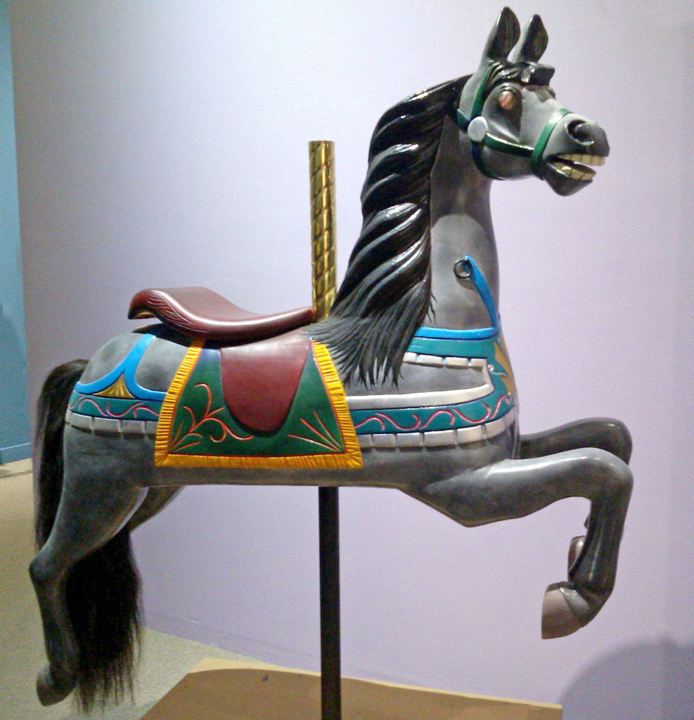 Restored Dare carousel horse from the Lourinda Bray, Running Horse Studio collection. The front has the iconic (chest strap) martingale. The decorations at the front of this Dare are more elaborate than usual.